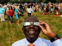 New UMass Dartmouth Chancellor Robert Johnson joins the crowd who gathered in front of the UMass Dartmouth observatory to view the partial solar eclipse that swept over the area.   [ PETER PEREIRA/THE STANDARD-TIMES/SCMG ]